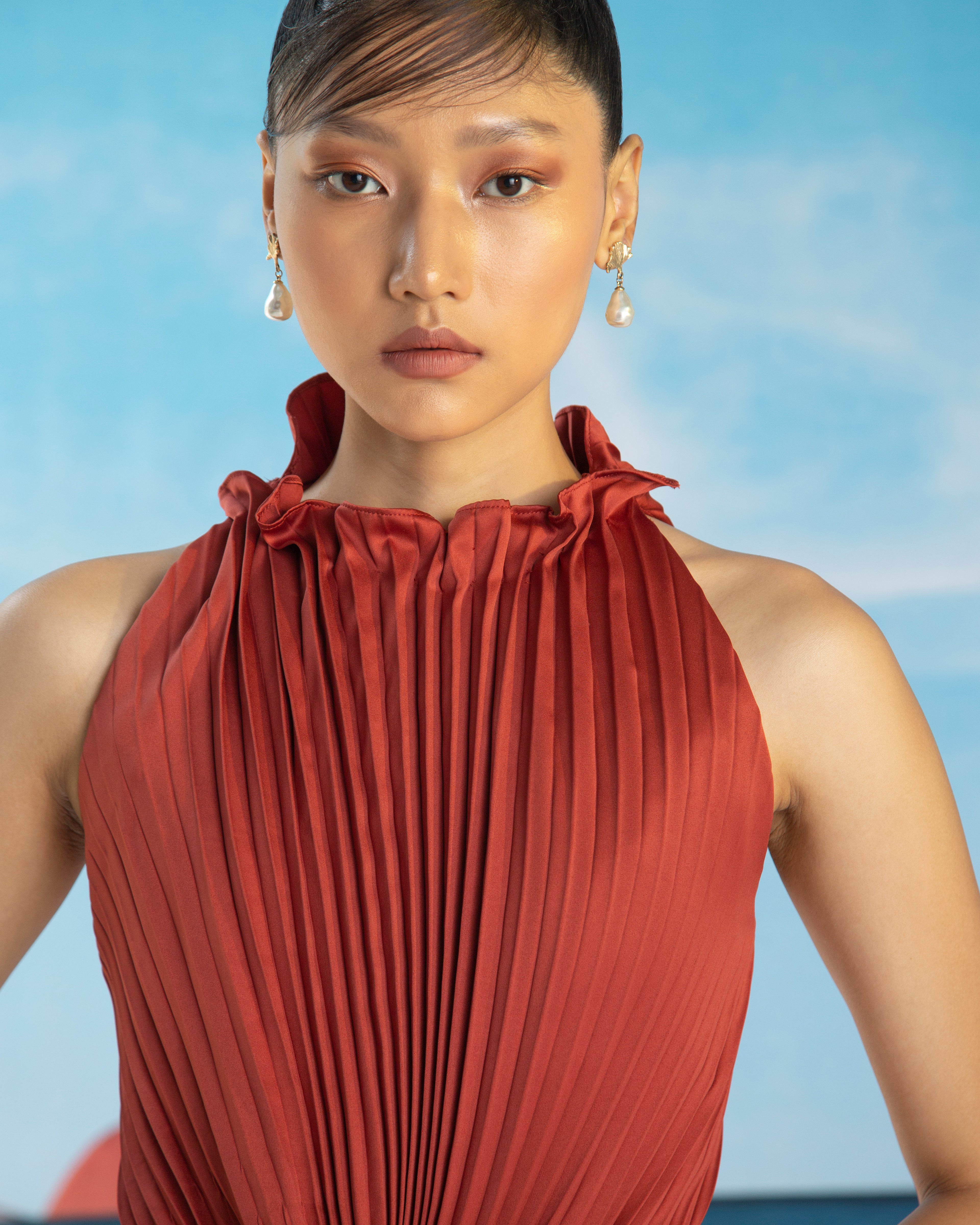 ORANGE PLEATED HALTER GOWN